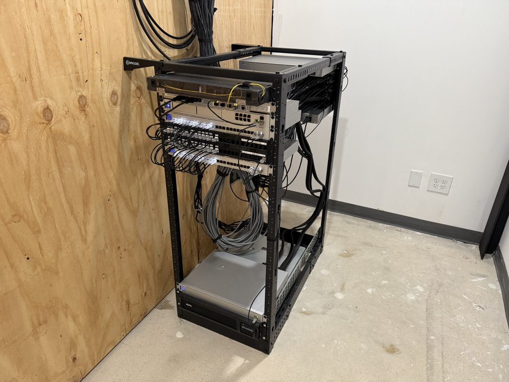 Open-frame network rack with switches, router and UPS for a business